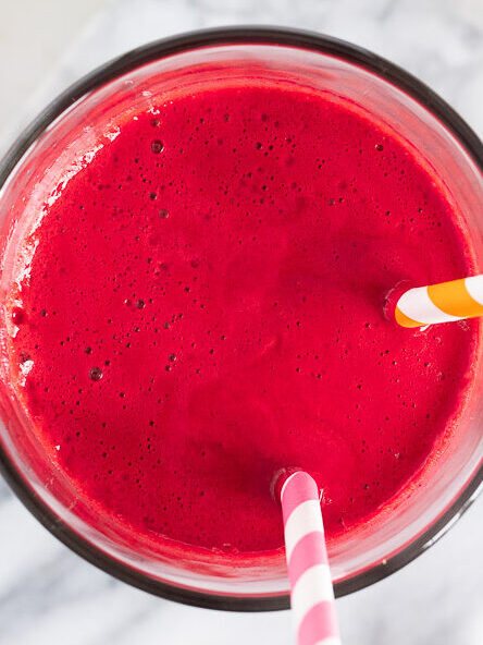 stirring abc juice in a glass