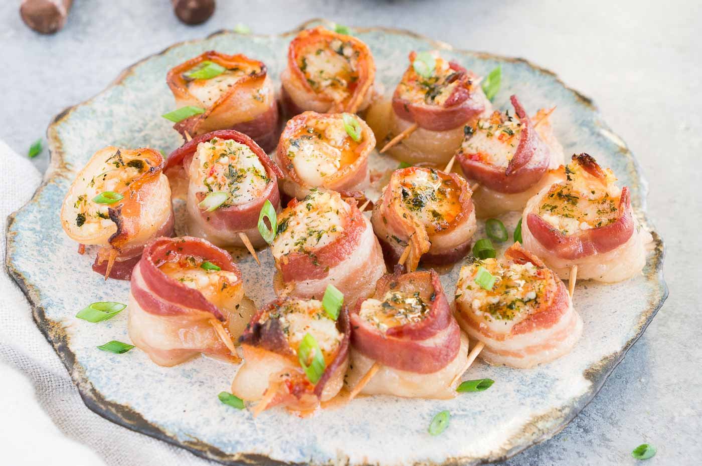 scallops wrapped in bacon on a plate