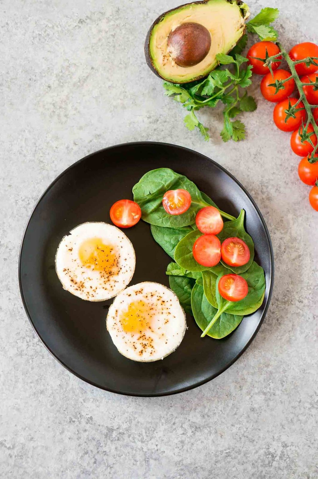 oven baked eggs on a plate with vegetables