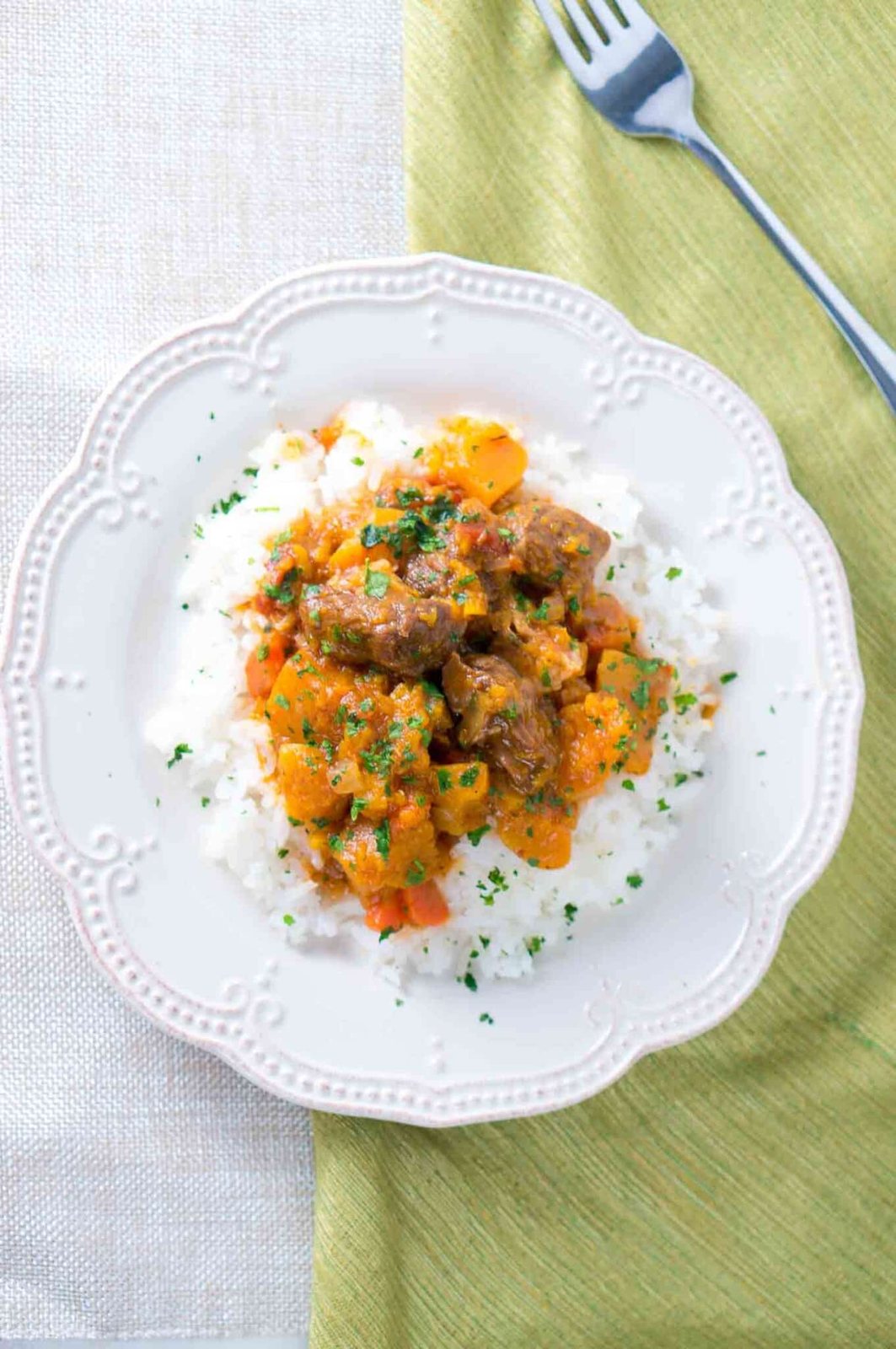 Beef and Butternut Squash Stew served over rice