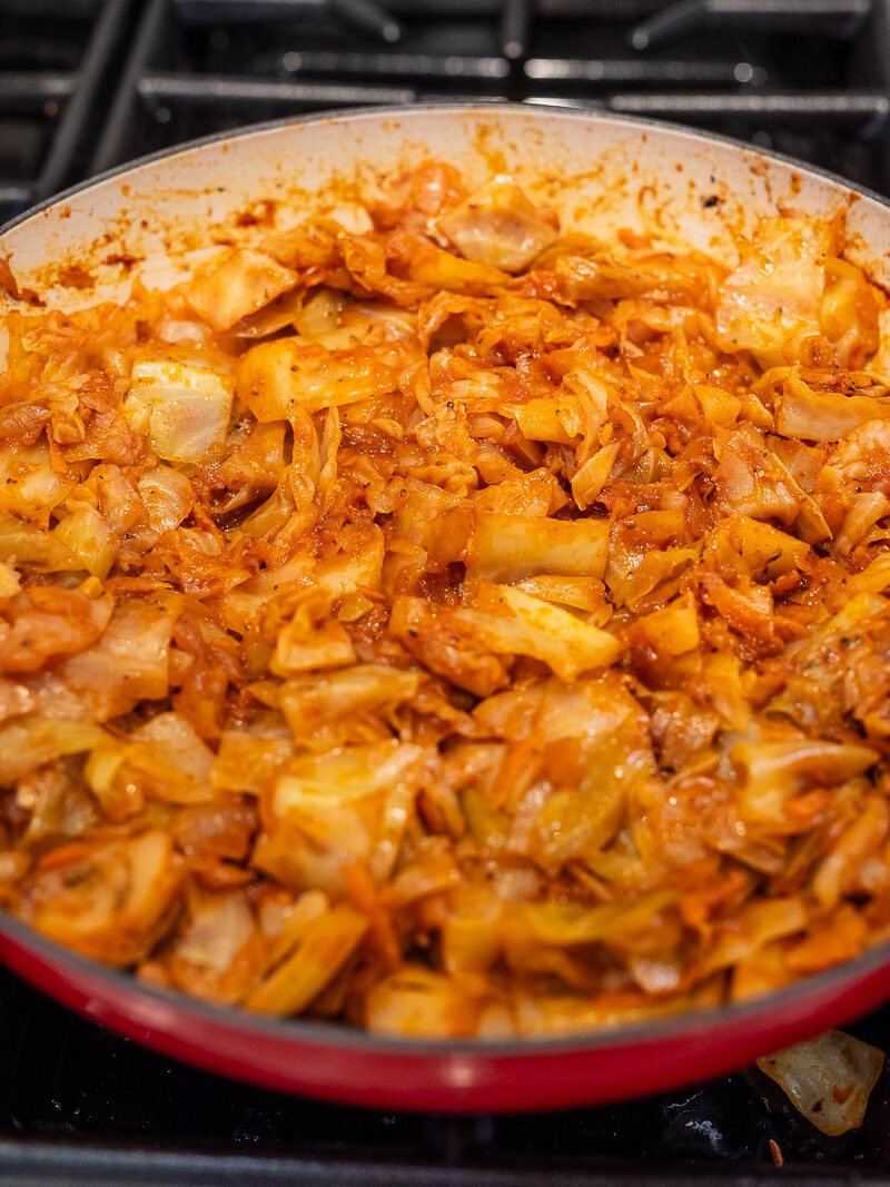 cooking ground beef and cabbage in a large skillet