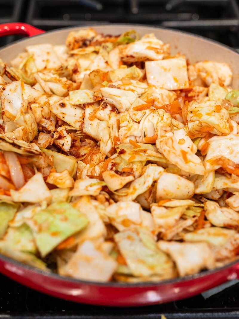 cabbage and vegetables sauteing in the skillet
