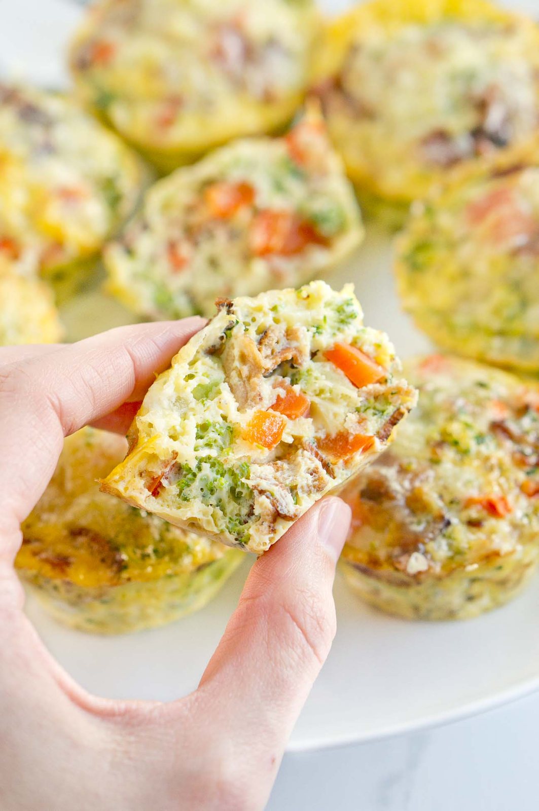 holding a breakfast egg muffin