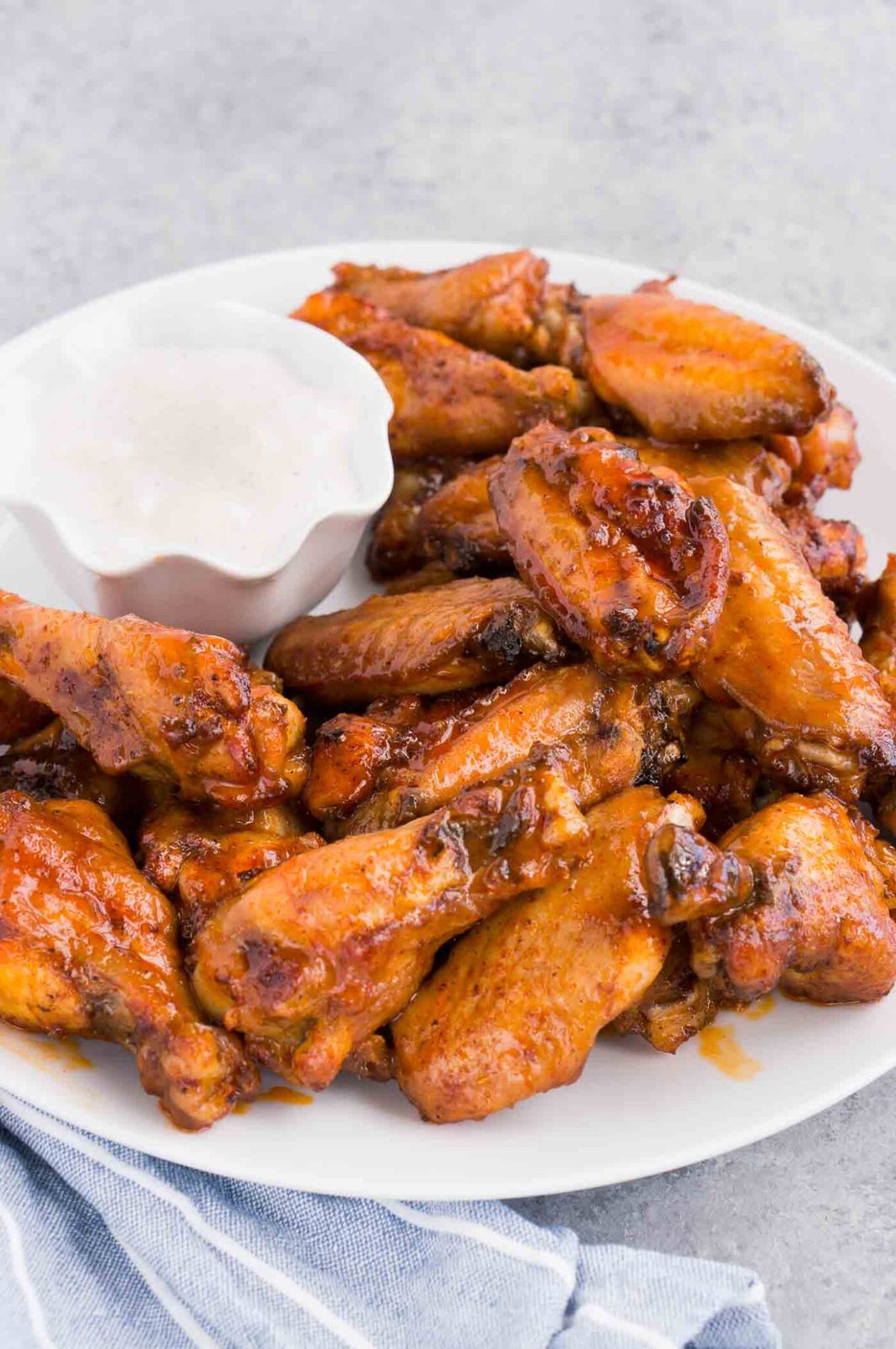 hot chicken wings and sauce on a plate