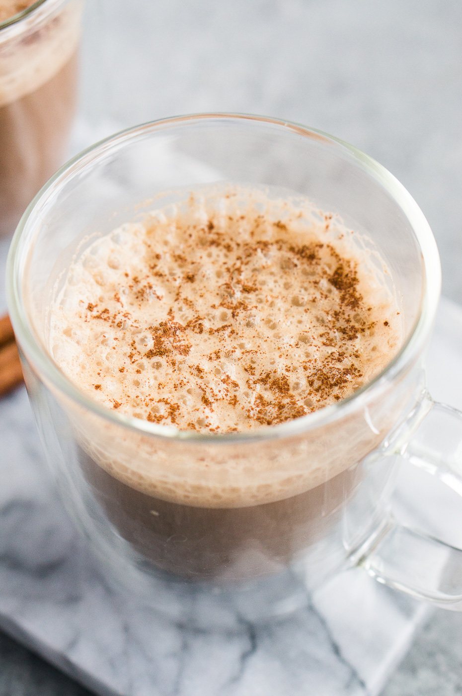 bulletproof coffee with coconut oil in a glass cup