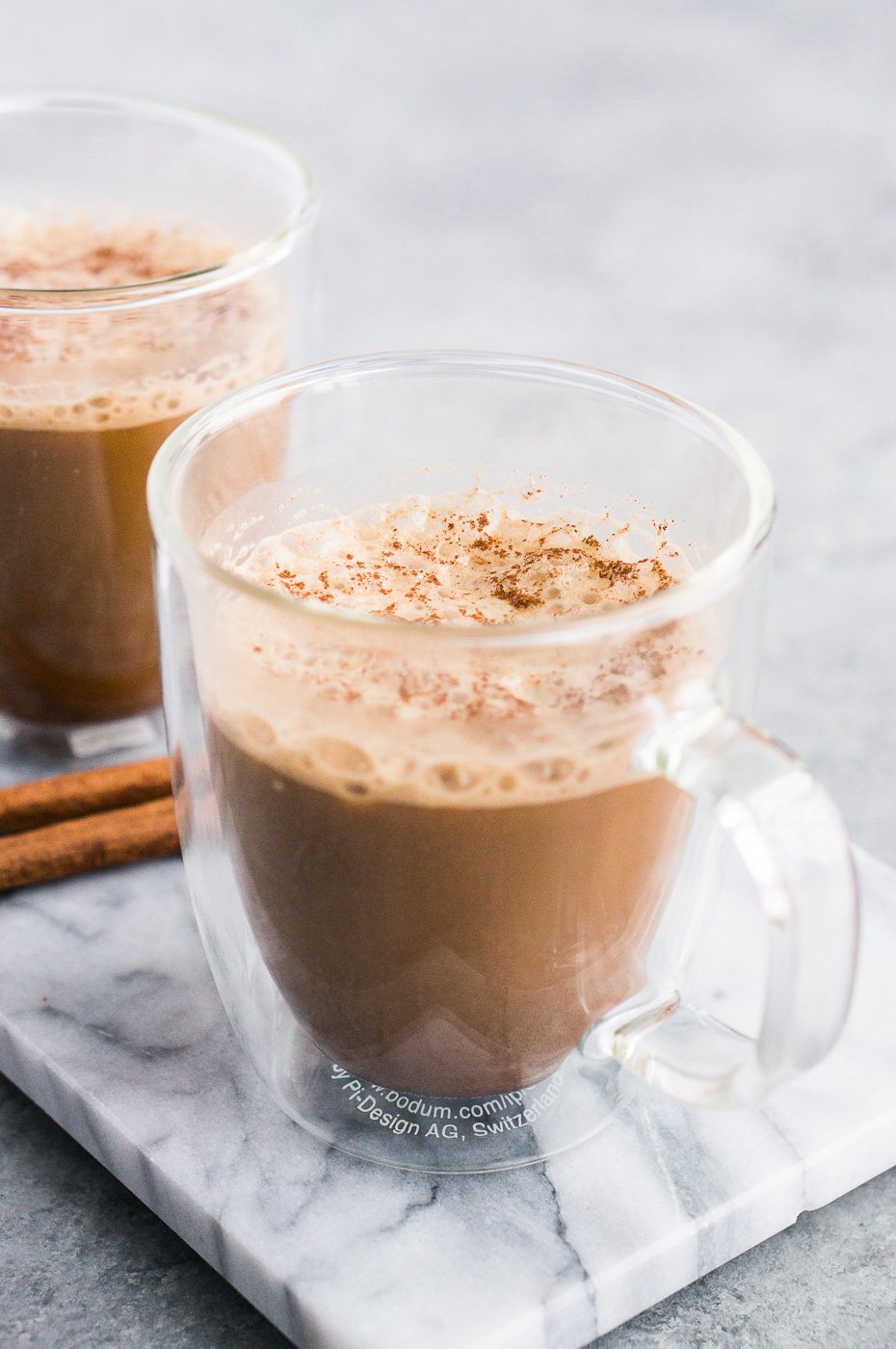 bulletproof coffee recipe made with coconut oil and served in a glass cup