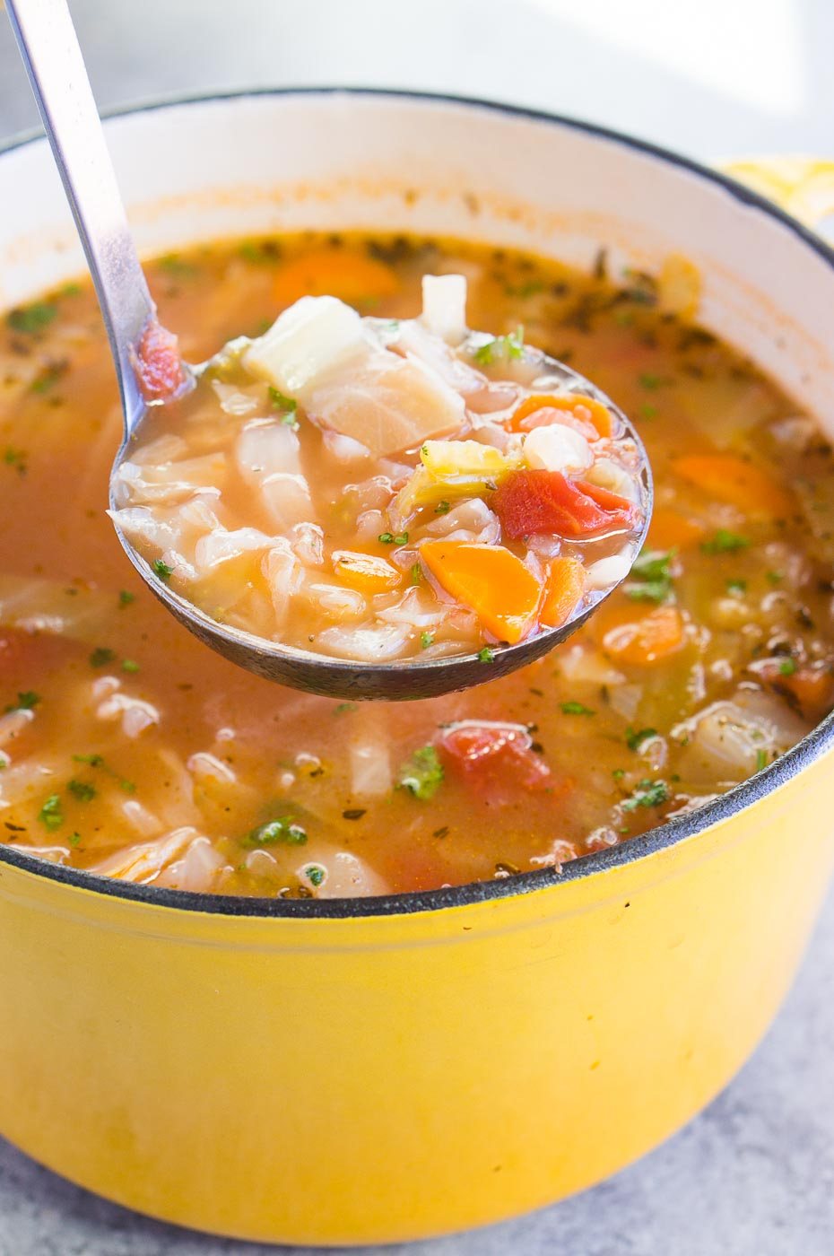 serving vegetable soup with cabbage