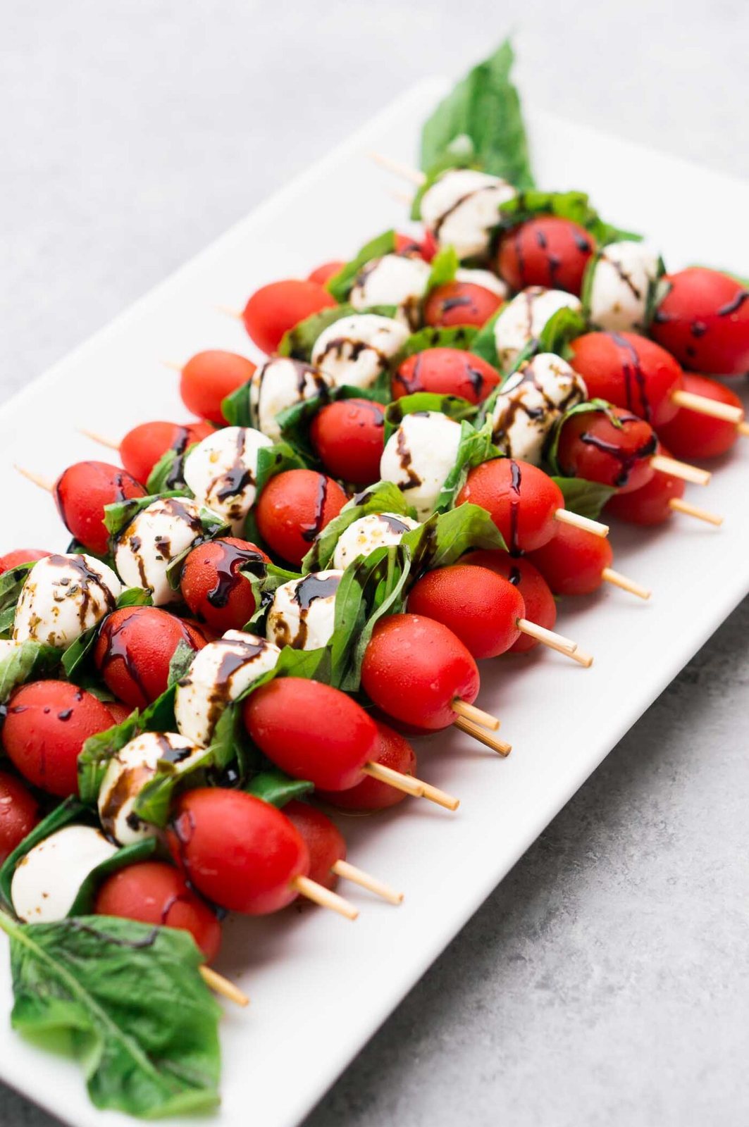 mozzarella tomato skewers on a platter
