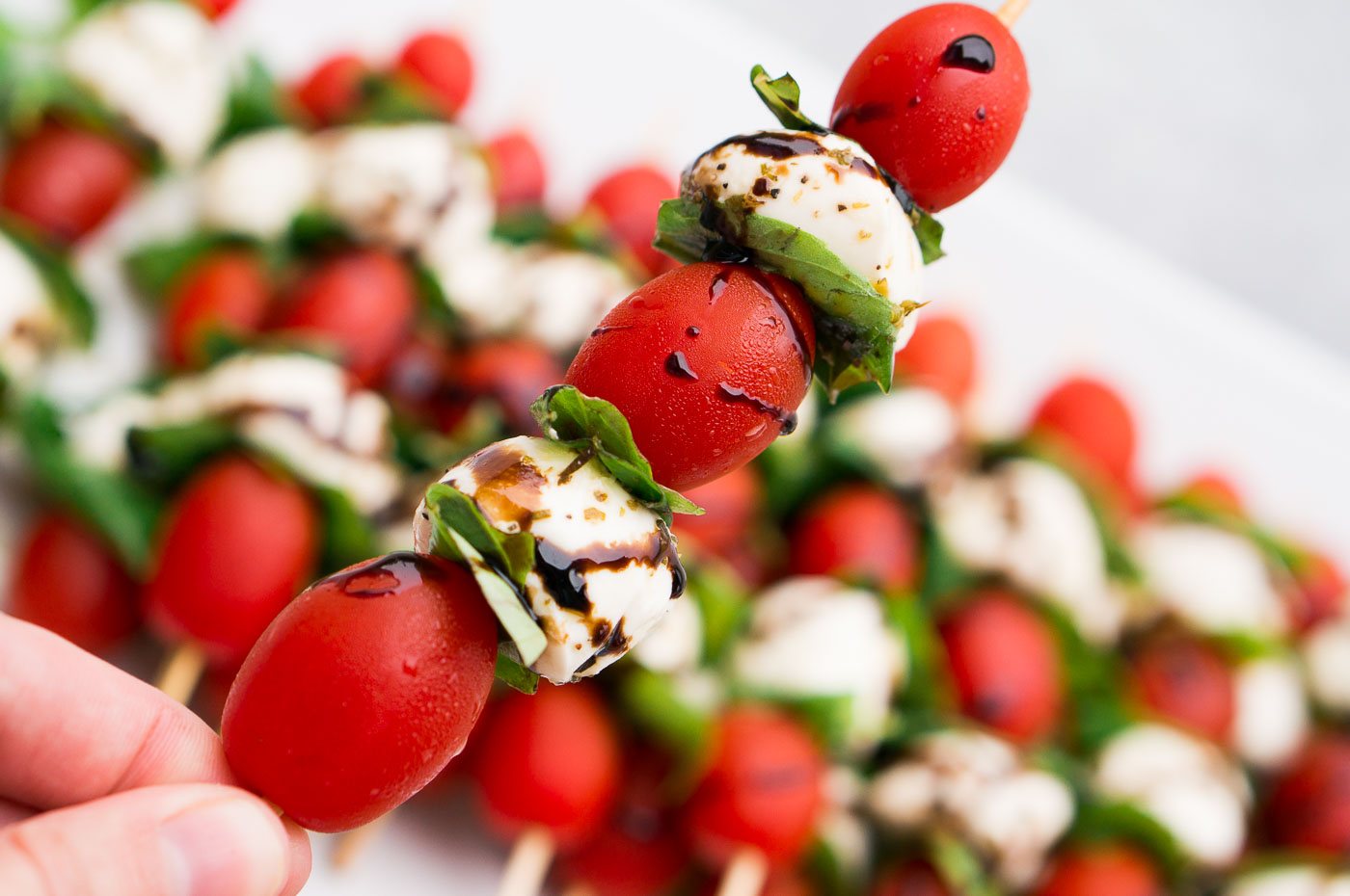 tomatoes mozzarella and basil appetizer on a stick
