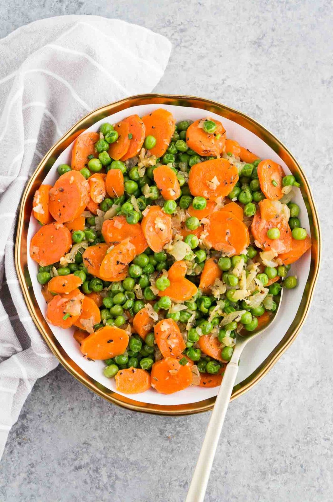 carrots peas and onions served in a bowl