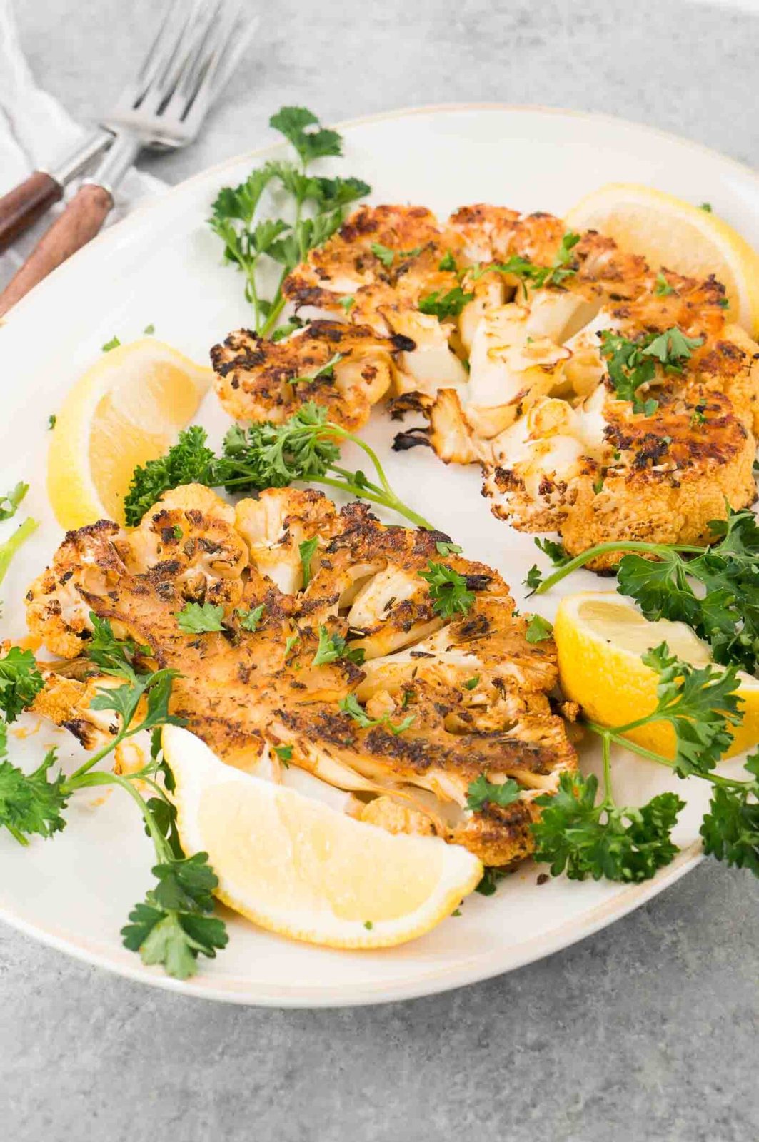 seasoned roasted cauliflower steaks on a plate