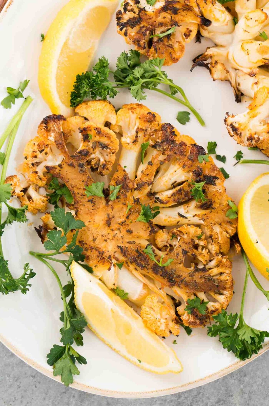 close up image of cauliflower steak on a platter