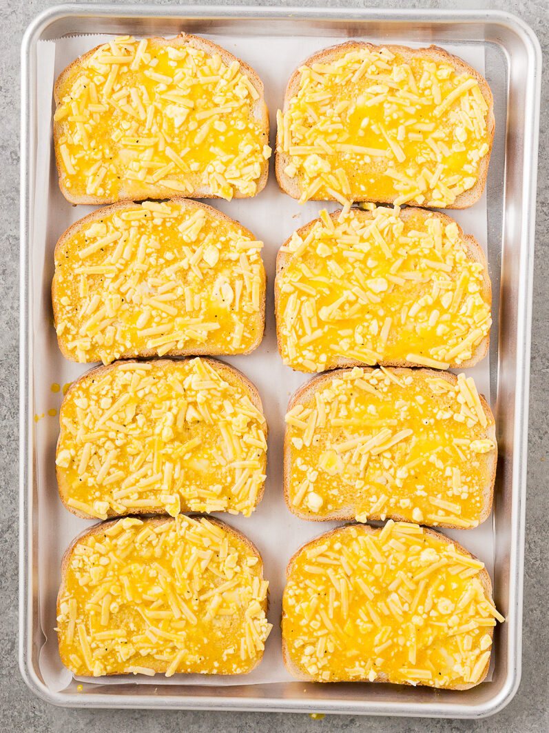 cheese and egg toasts on a baking sheet