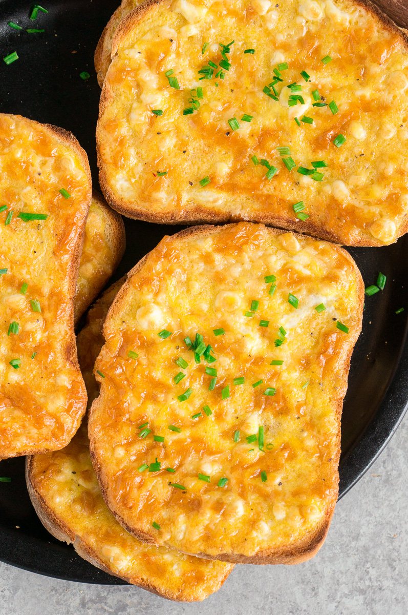 cheesy egg toast stacked on a plate
