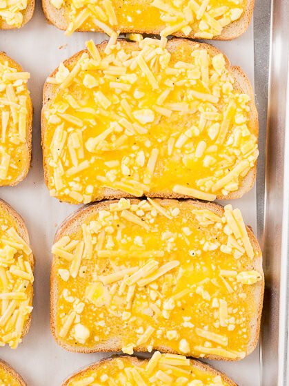 cheese and egg toasts on a baking sheet