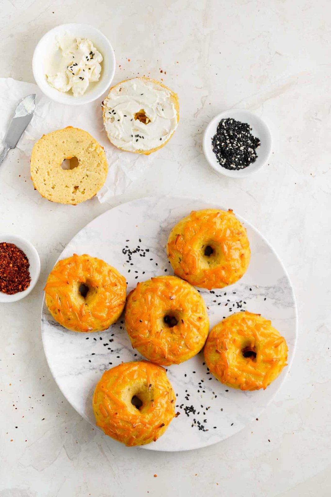 baked cheese bagels on a plate