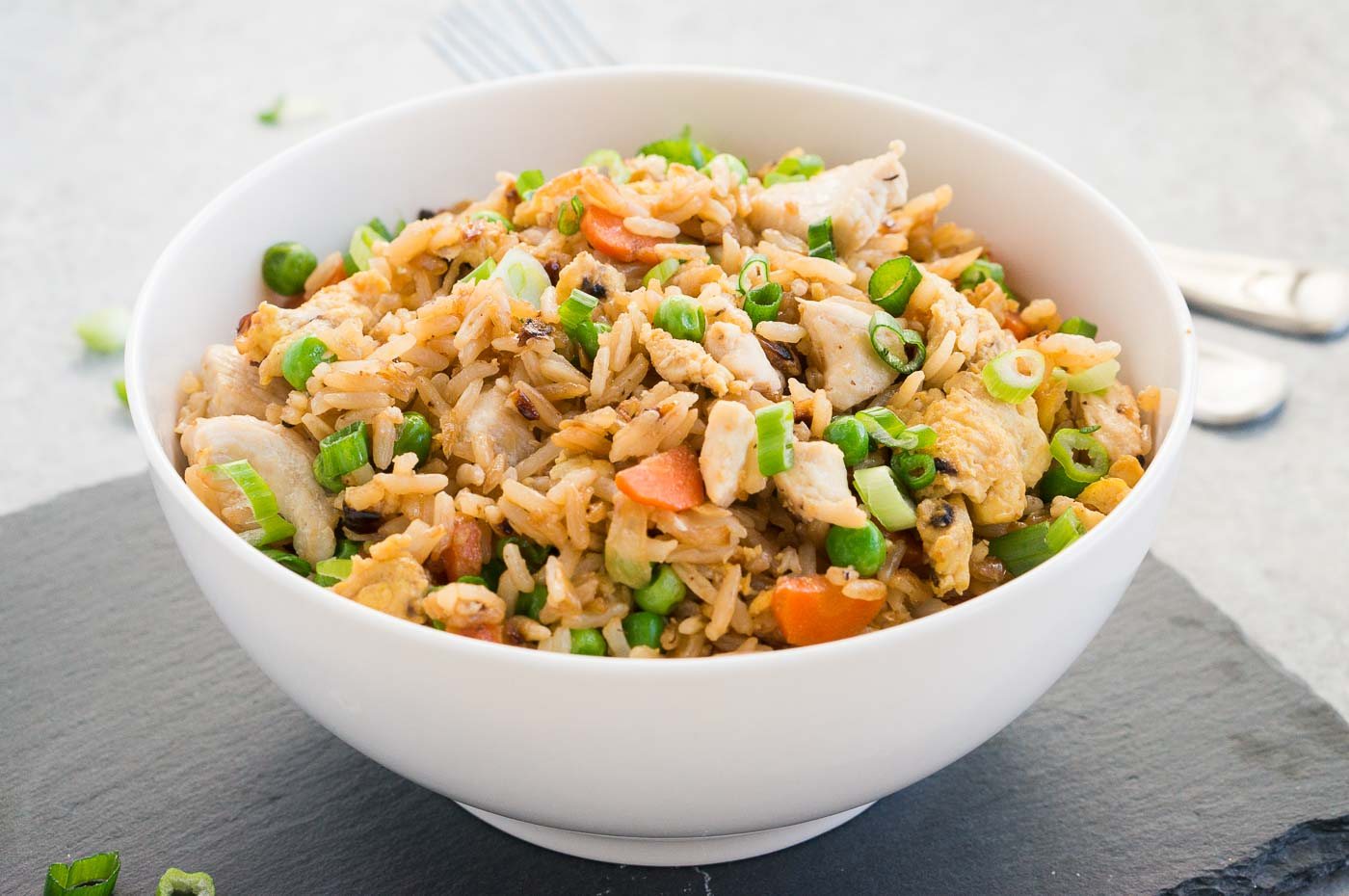 close up image of chicken fried rice in a bowl