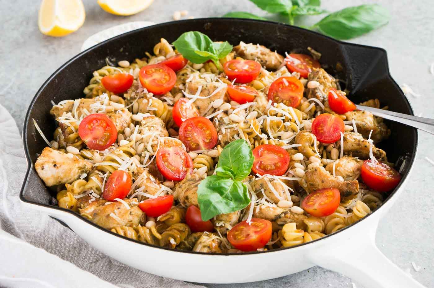 pesto pasta and chicken in a skillet