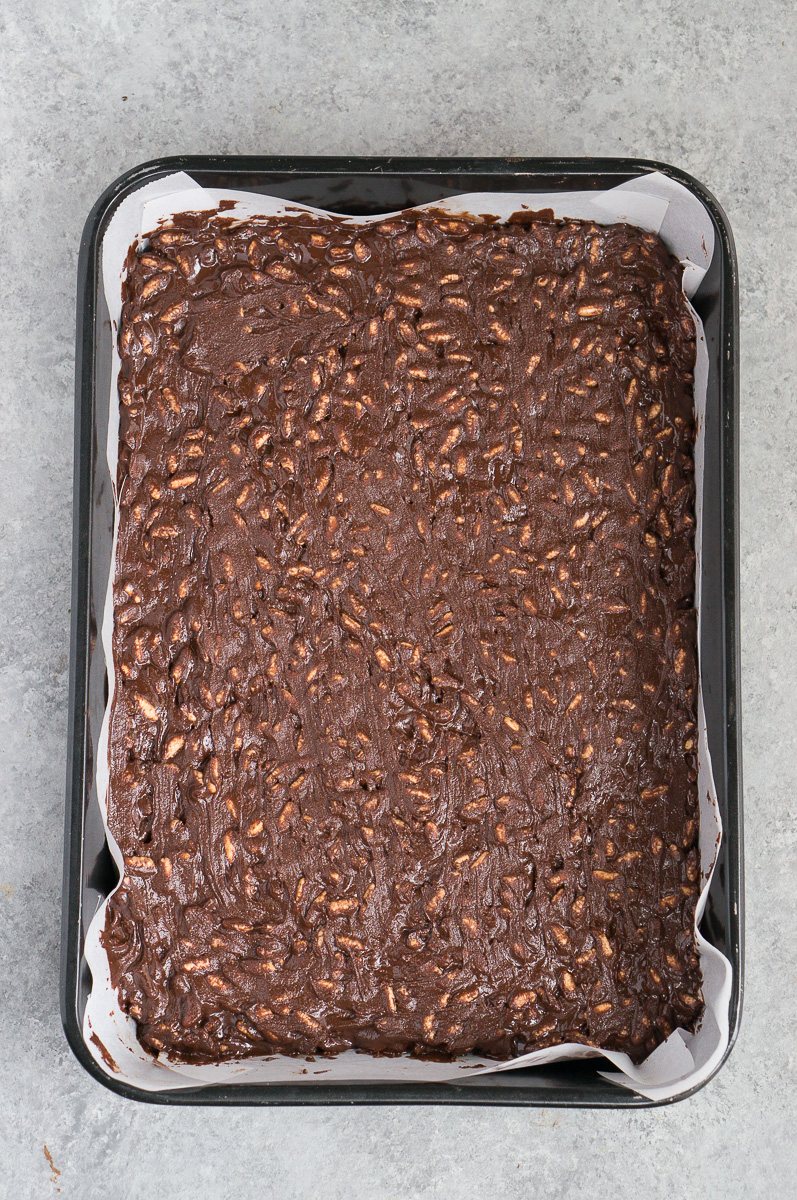 chocolate crunch mixture in a pan before freezing