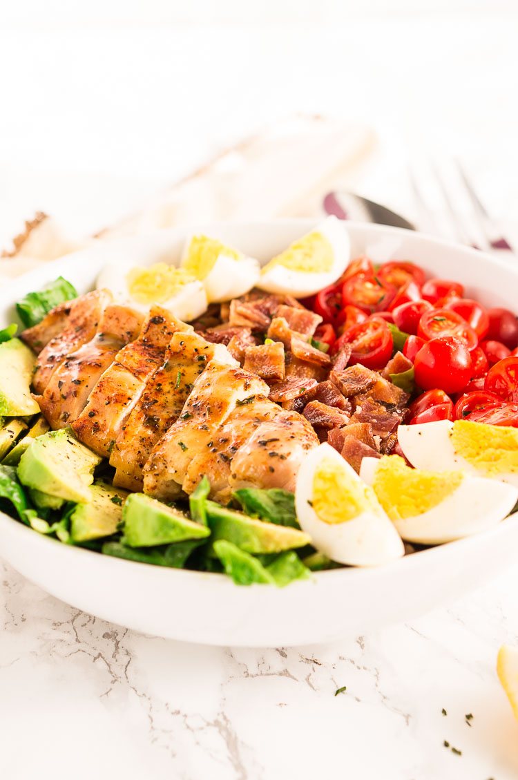 California Cobb salad made with chicken, bacon, tomatoes, avocados and eggs
