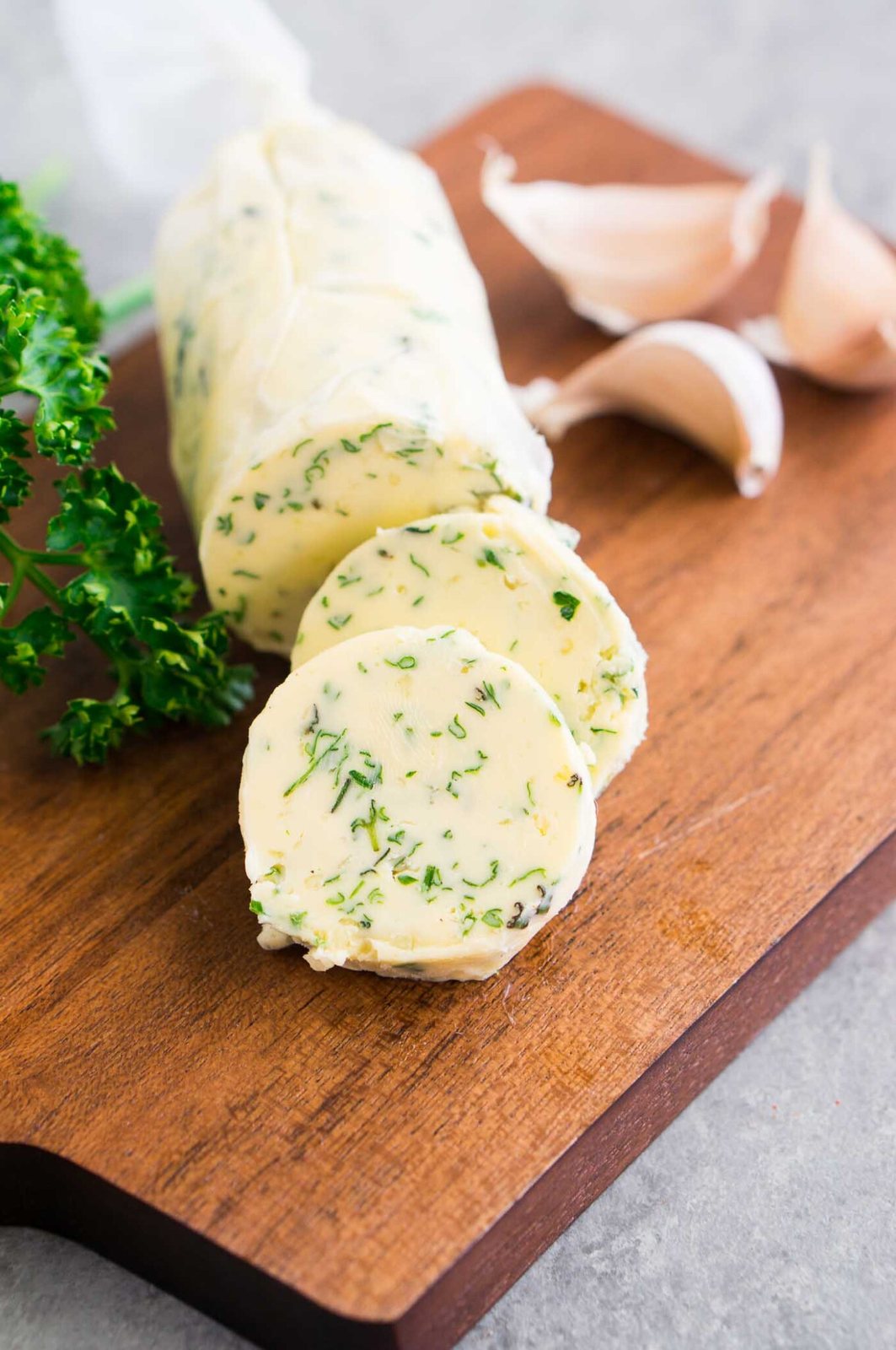 compound butter wrapped in parchment paper and sliced