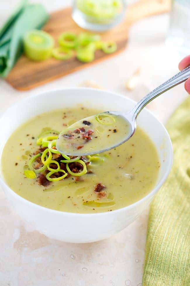 Creamy Potato and Leek Soup being eaten with a spoon