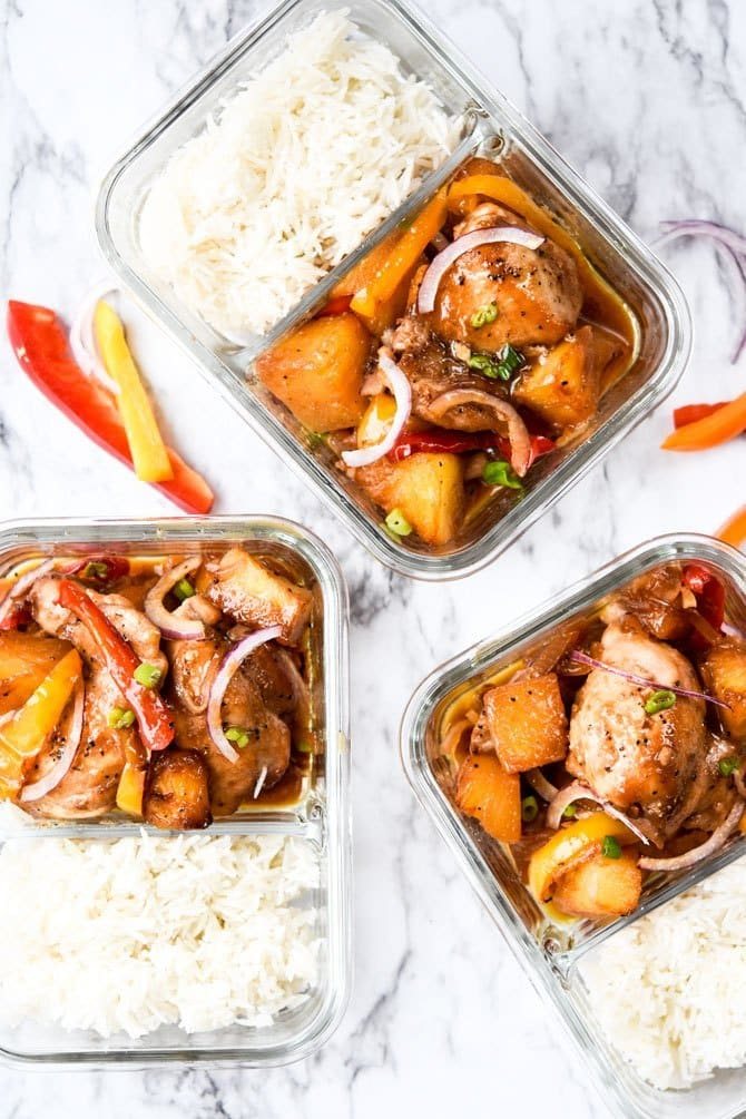 A glass container with Hawaiian Chicken and Rice meal prep
