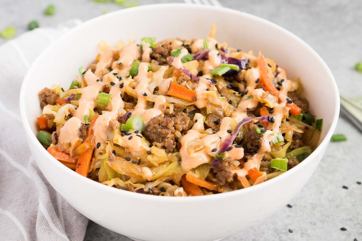 egg roll in a bowl with sriracha mayo