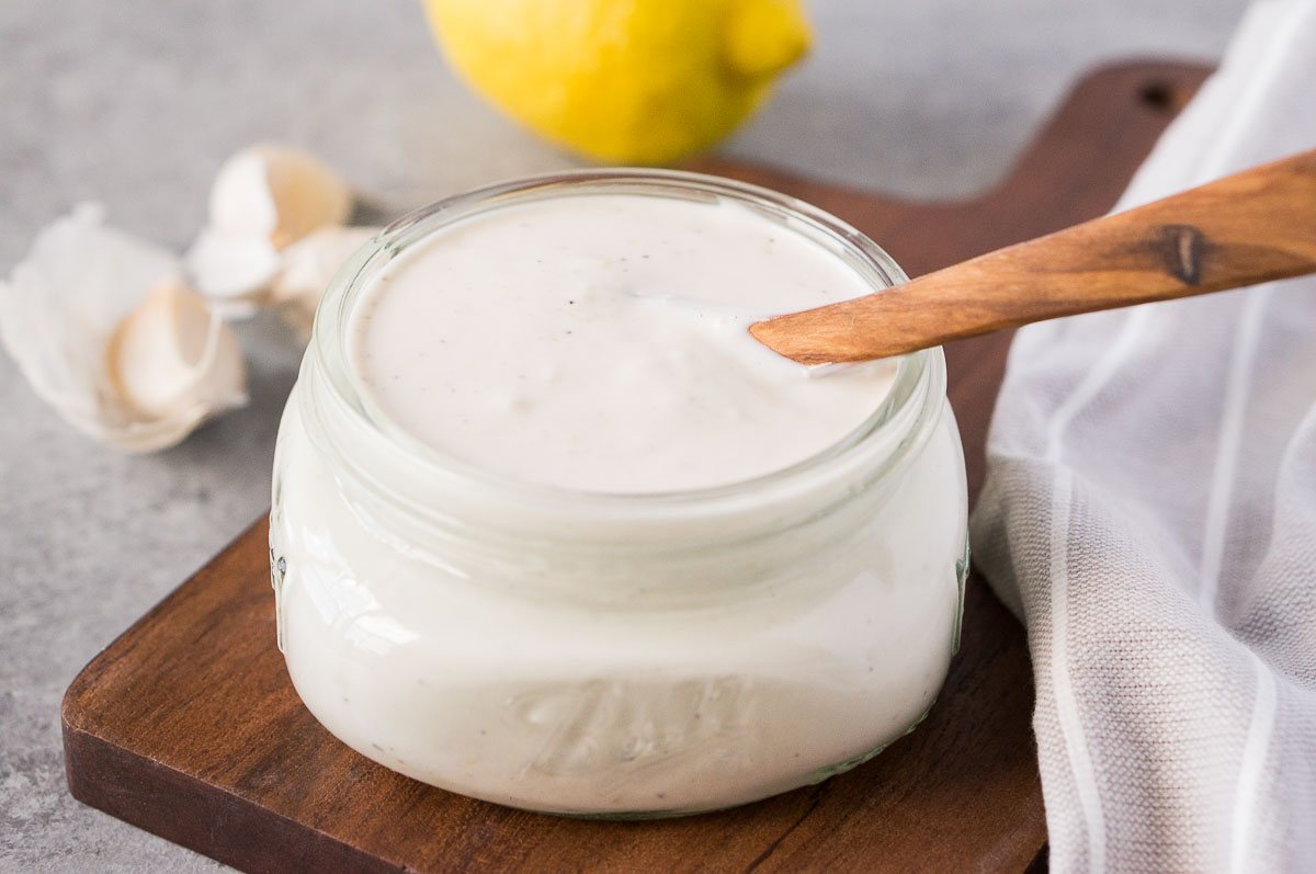 homemade garlic aioli stored in a jar