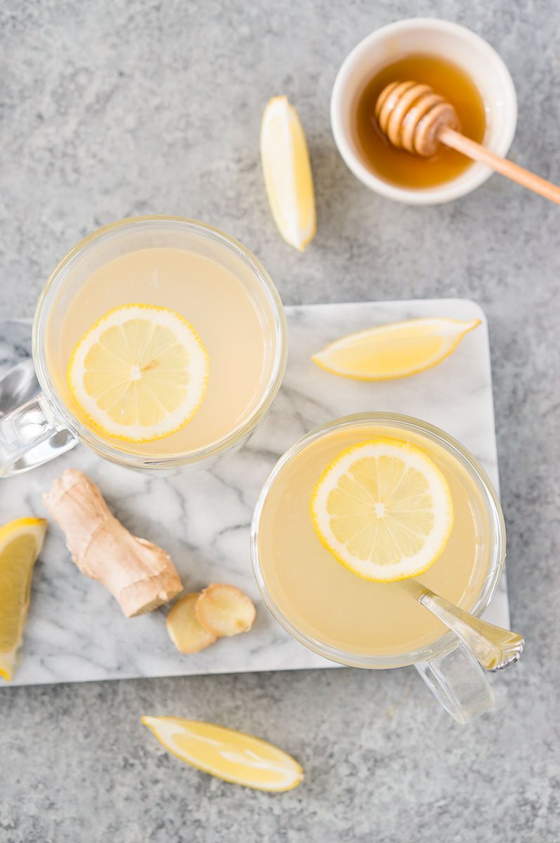honey ginger tea in glass cups with lemon slices