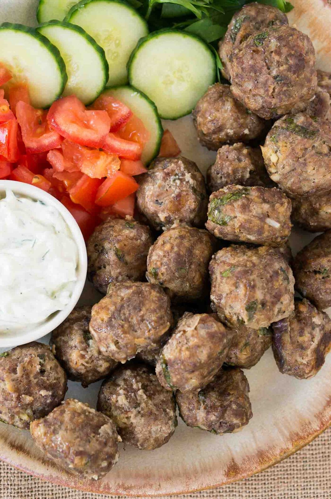 close up image of meatballs keftedes on a plate