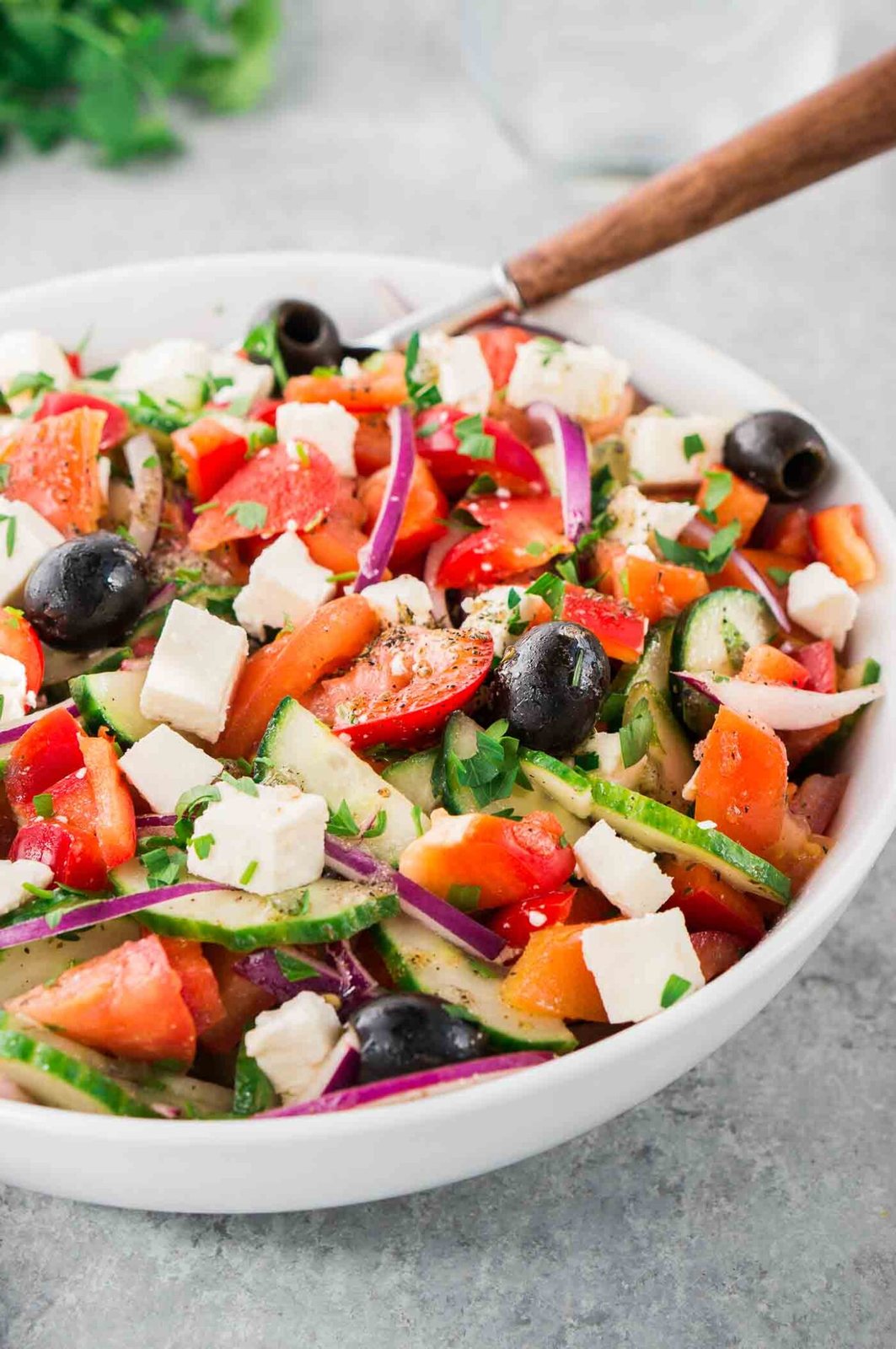 tomato cucumber feta salad in a bowl