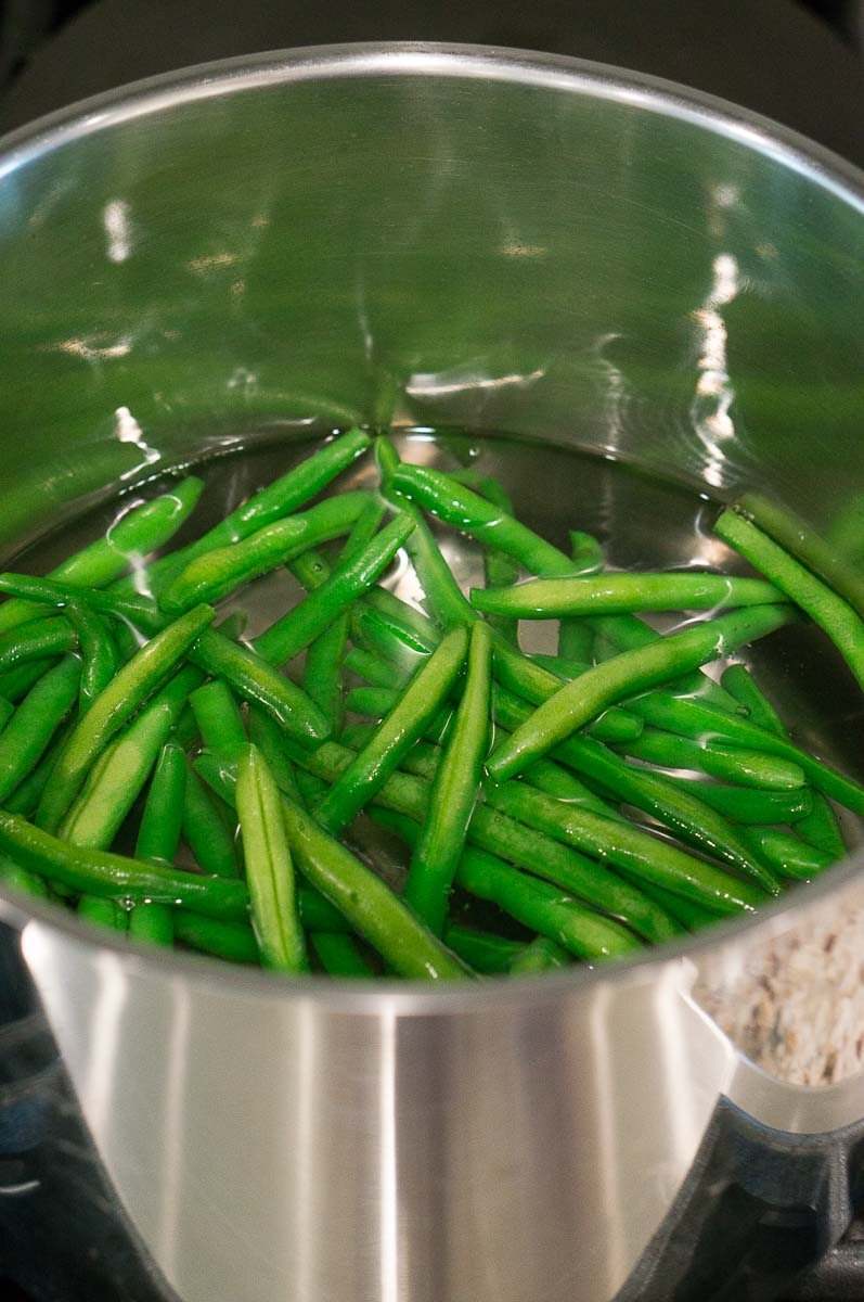 boiling green beans in a pot