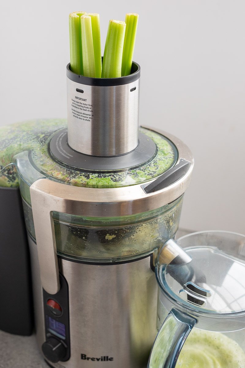 feeding celery in the juicer
