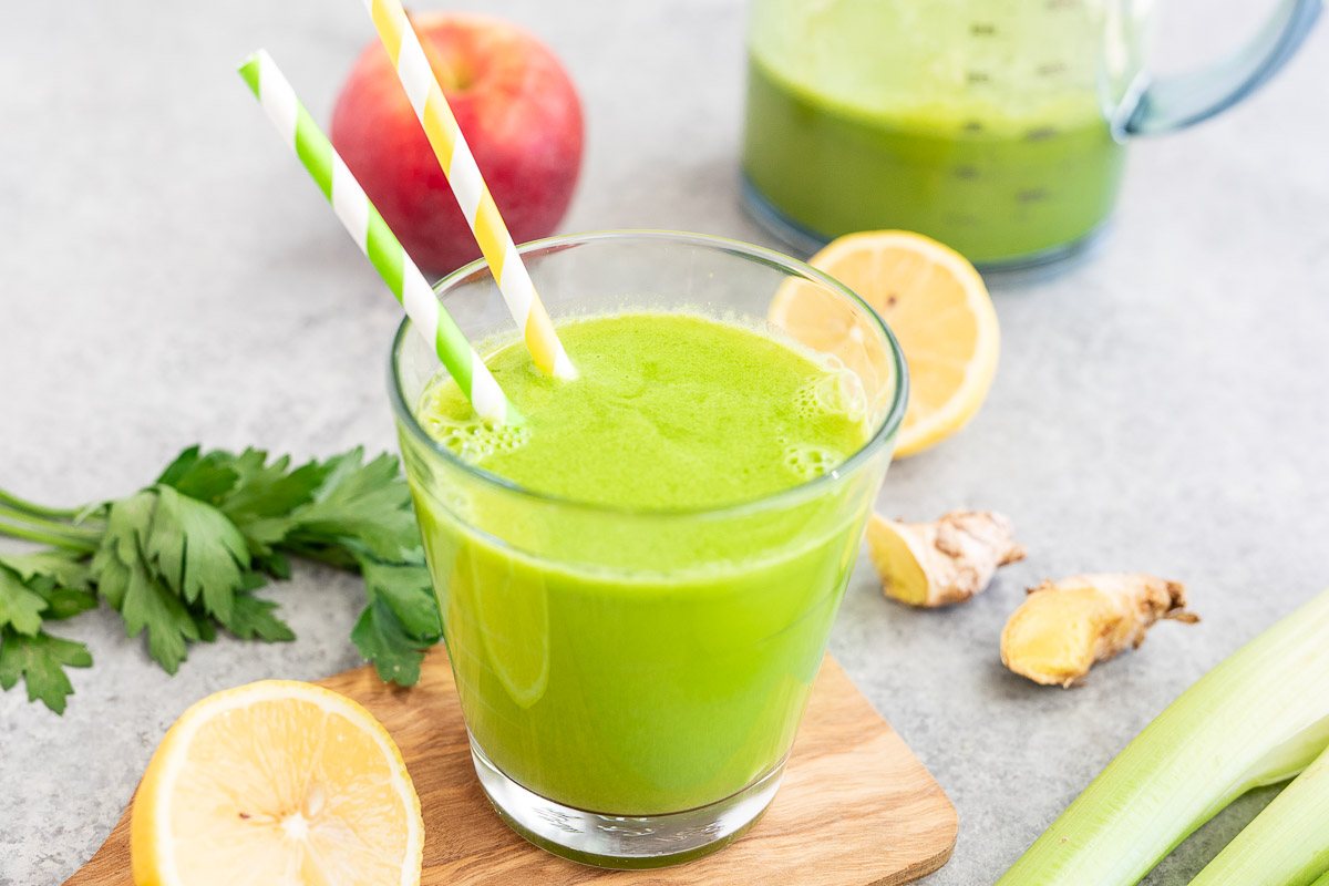 healthy and delicious green juice with cucumbers celery parsley apple