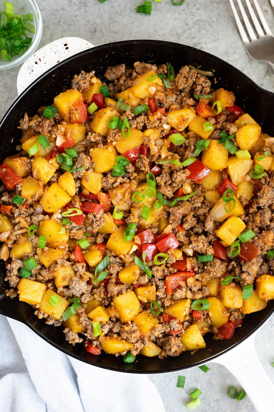 recipe for vegetables, beef and potatoes cooked in a skillet