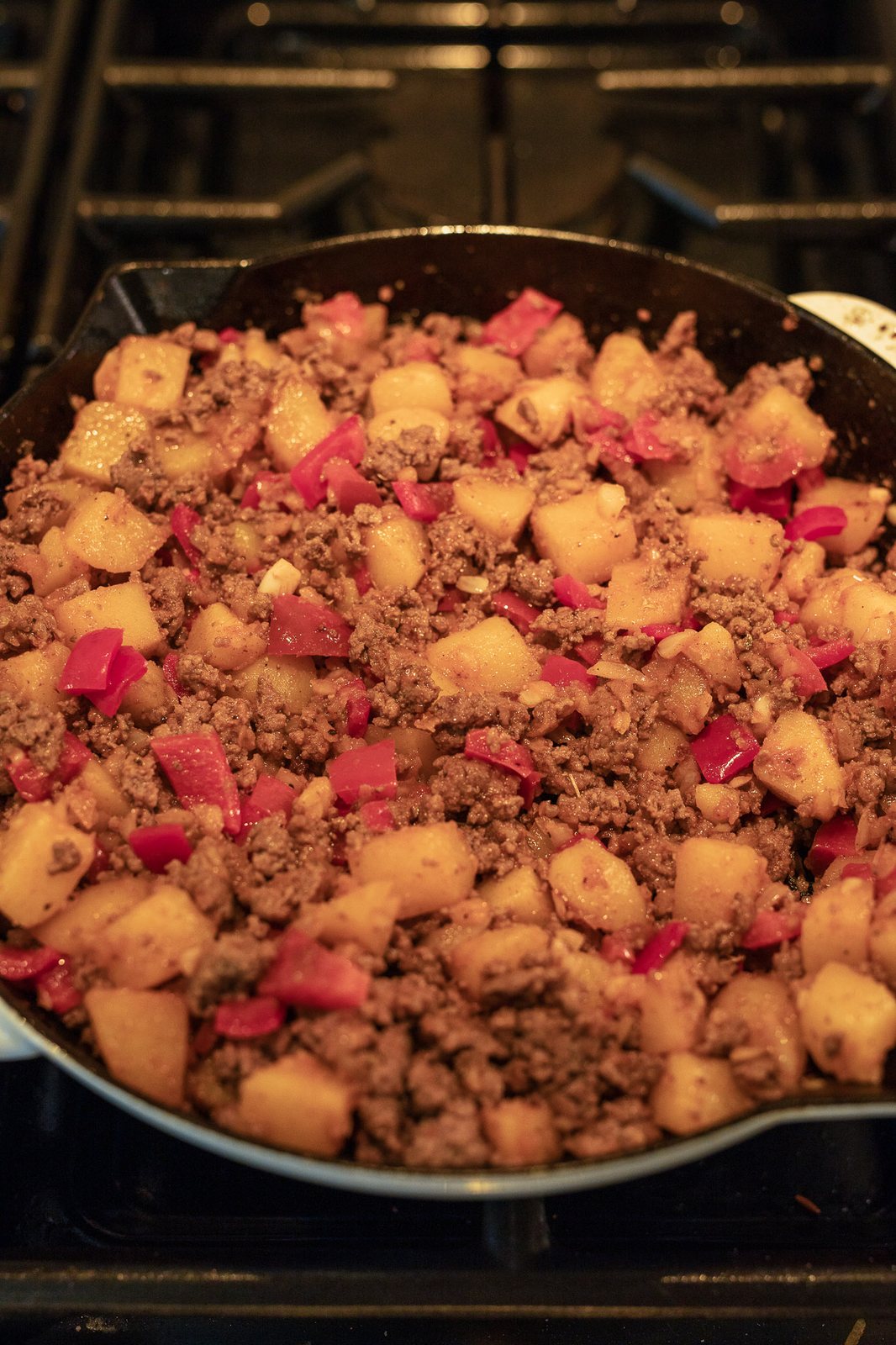 ground beef and potatoes cooked in a skillet
