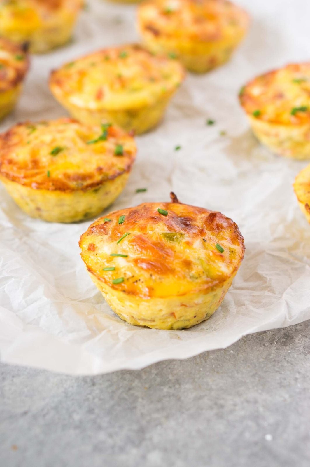 close up image of breakfast muffins with ham and cheese
