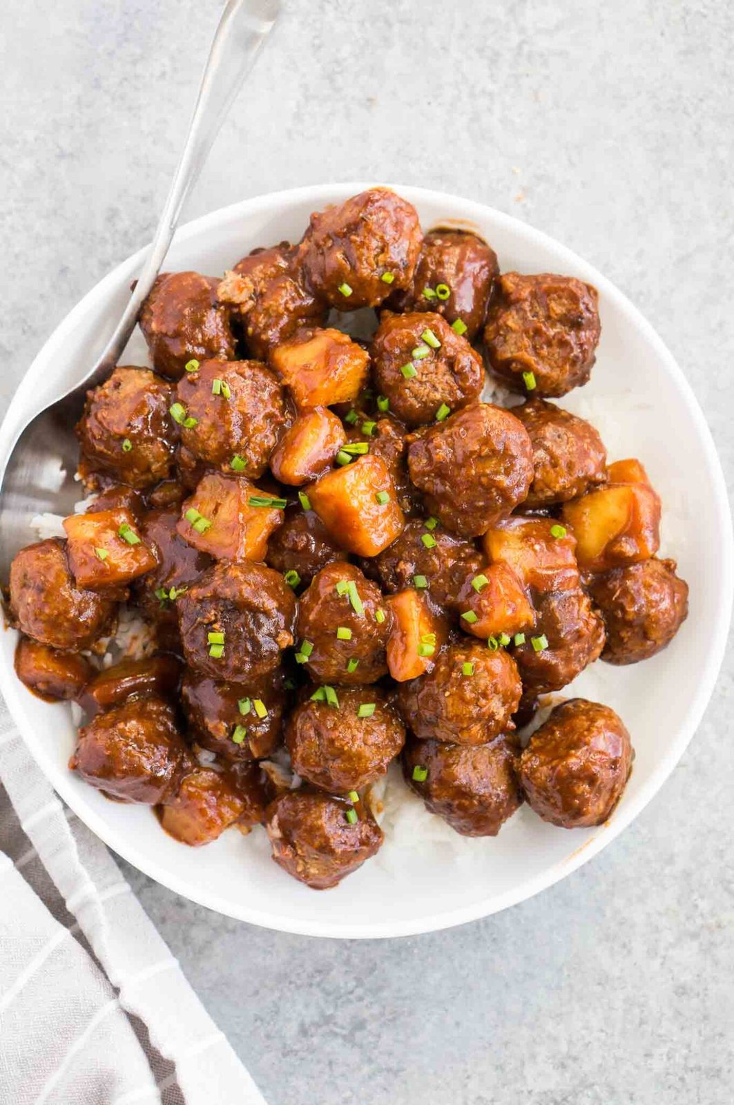 image from top of meatballs over rice in a plate