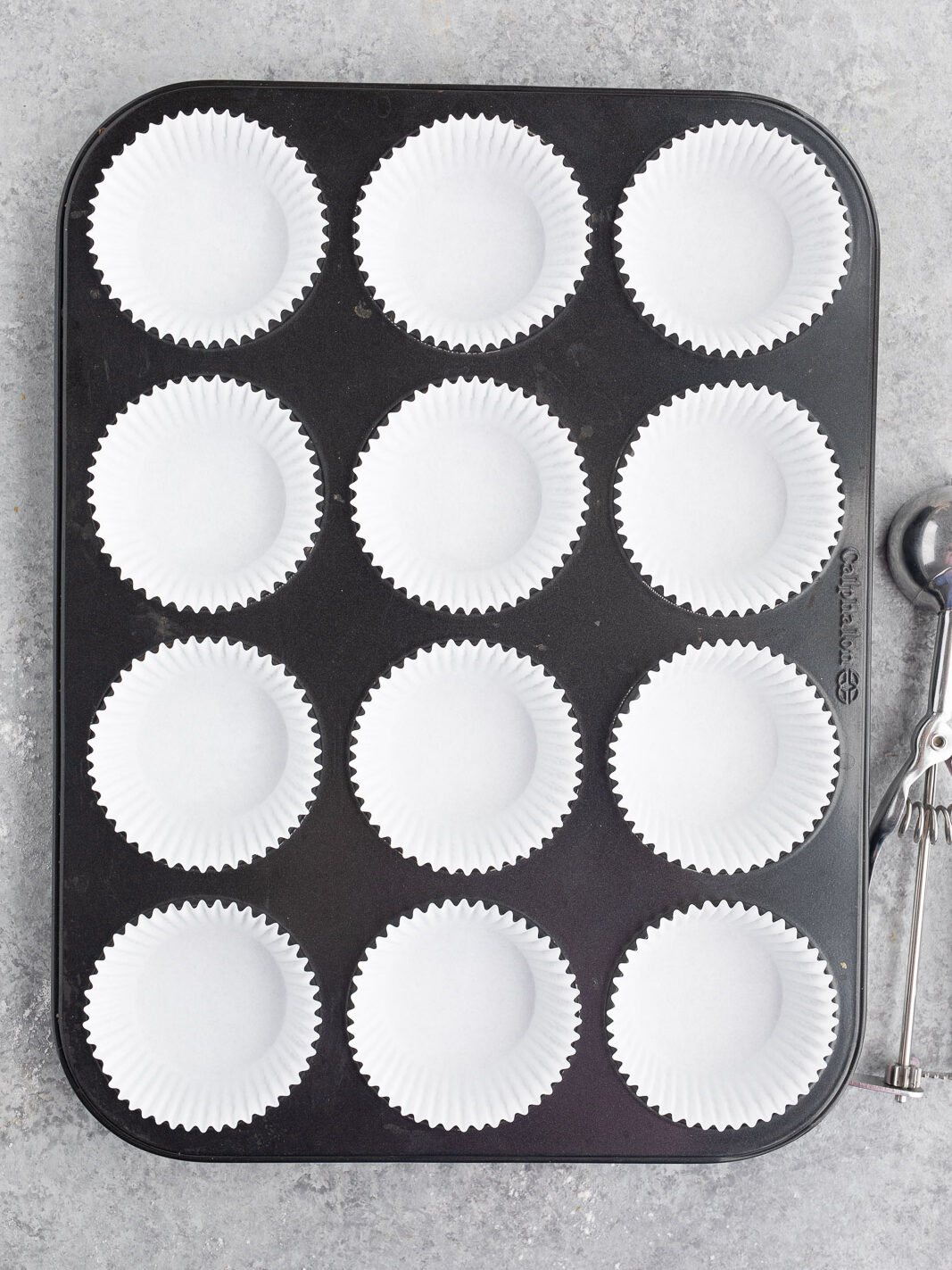 prepped muffin tin with paper baking cups