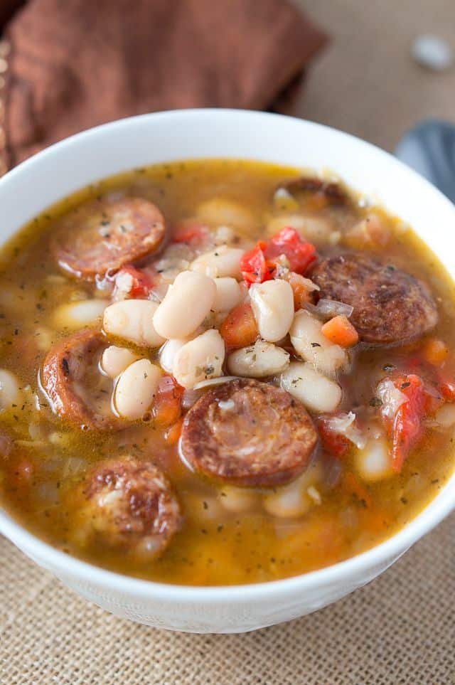 Close up of the Hearty White Bean Soup with Sausage in a white bowl