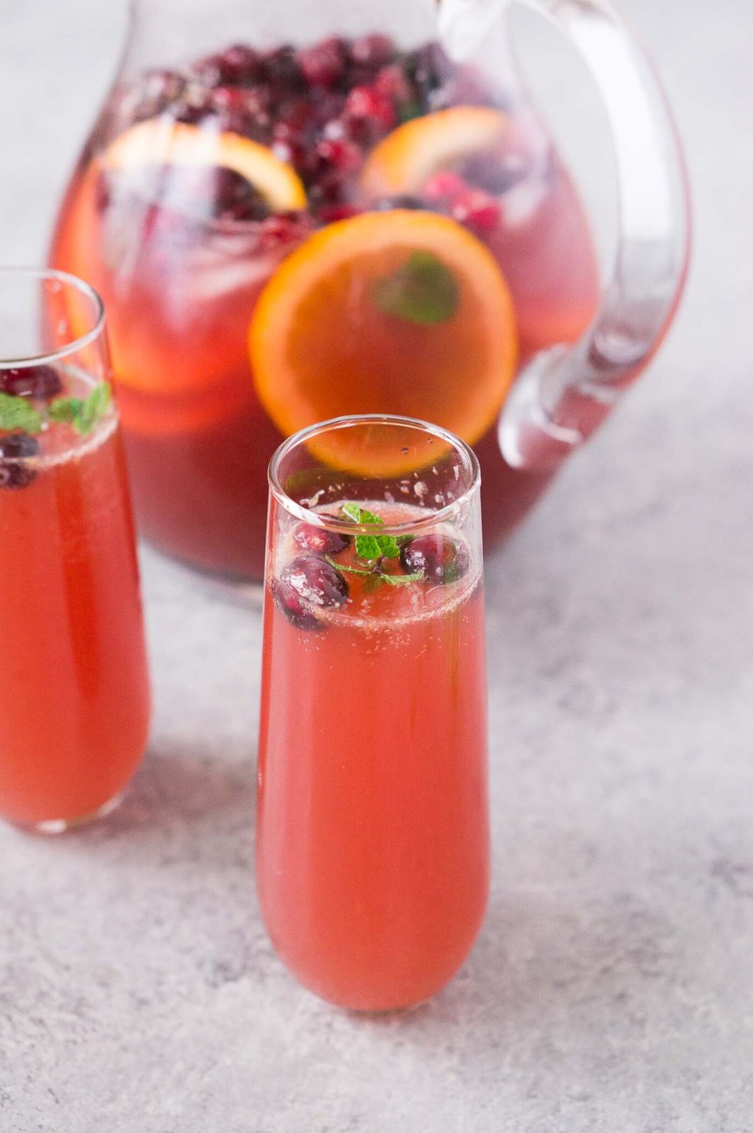 nonalcoholic holiday punch in glasses and pitcher