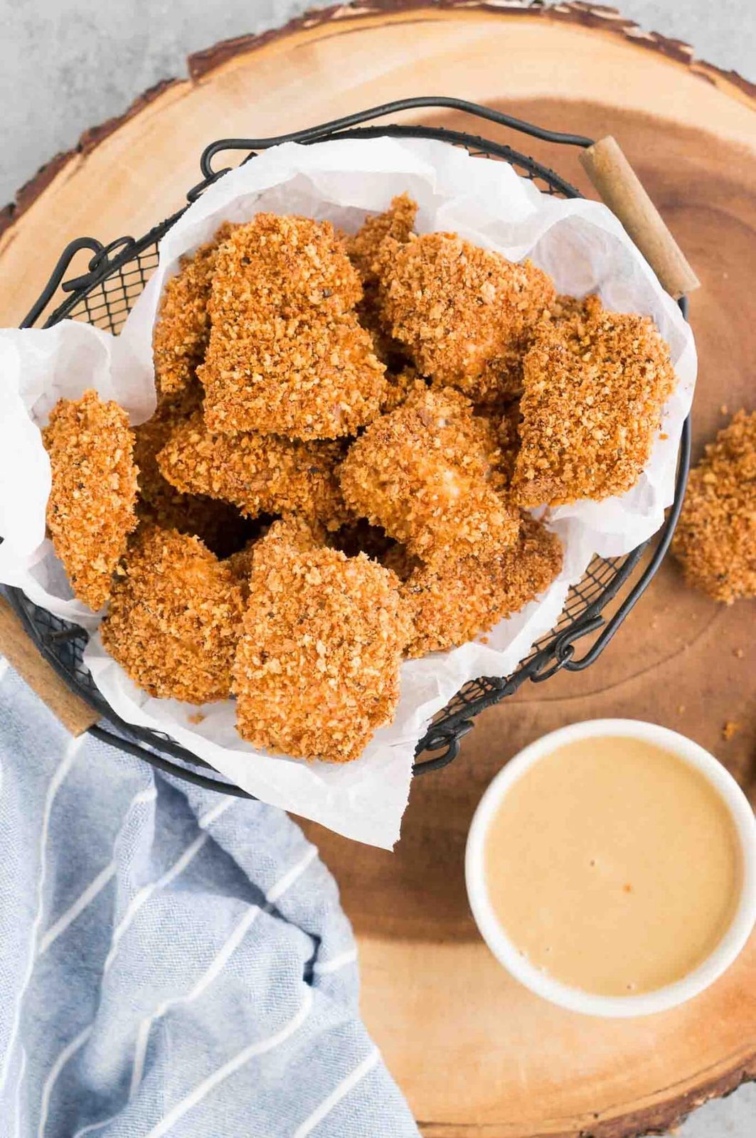 homemade chicken nuggets in a basket and honey mustard sauce