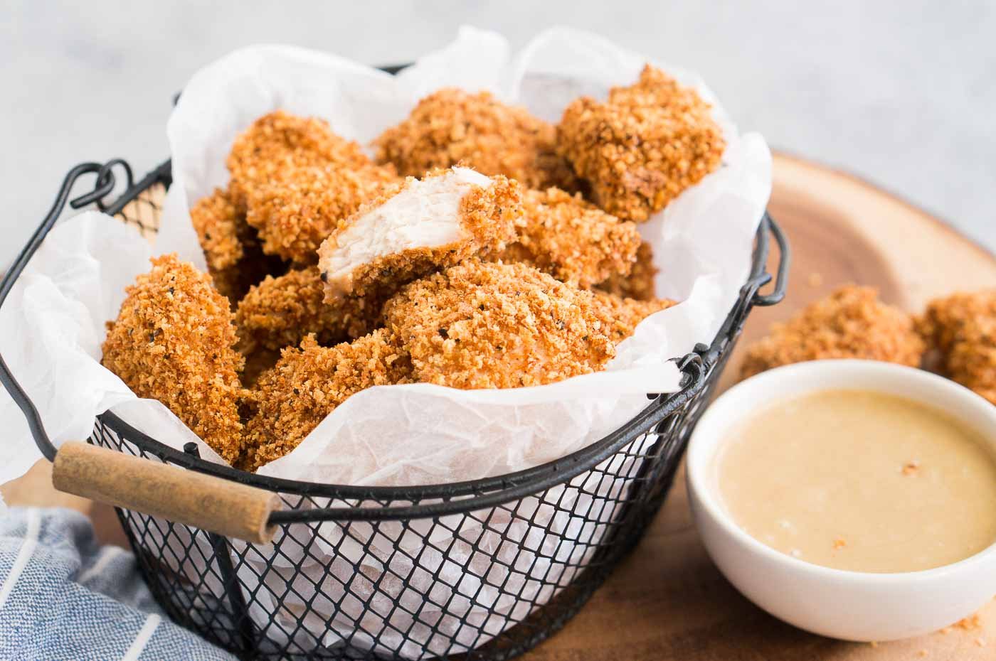 tender and crispy chicken bites in a basket