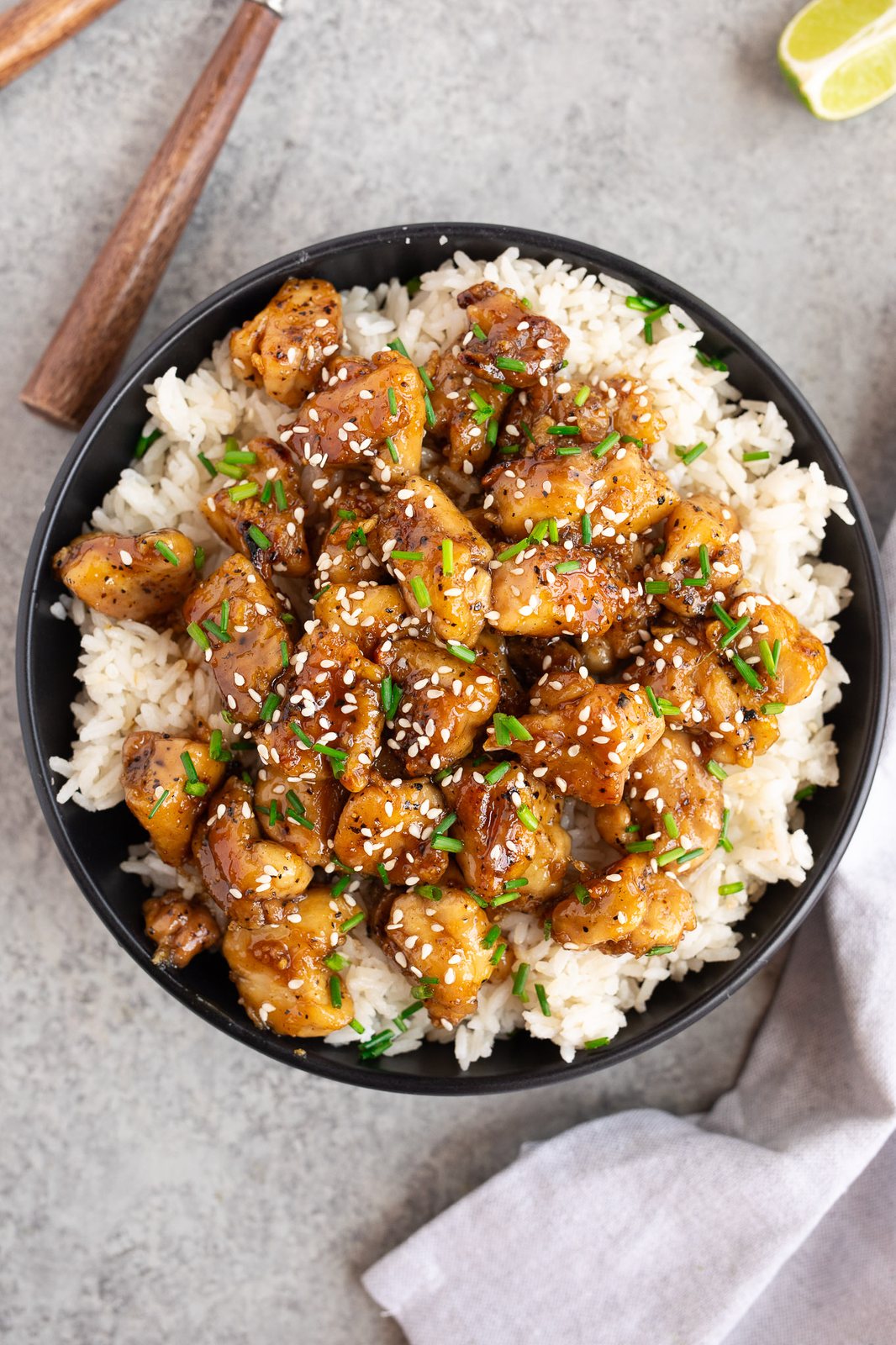 chicken with honey garlic sauce in a bowl with rice