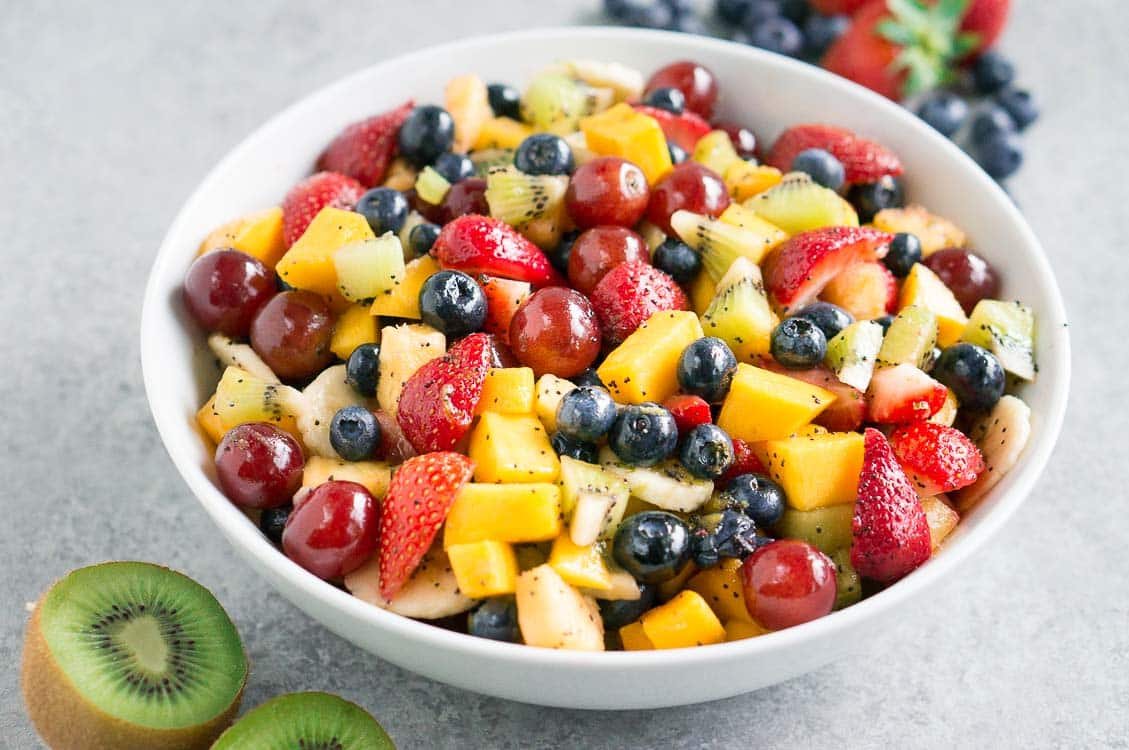 Easy summer fruit salad with honey lime poppy seed dressing