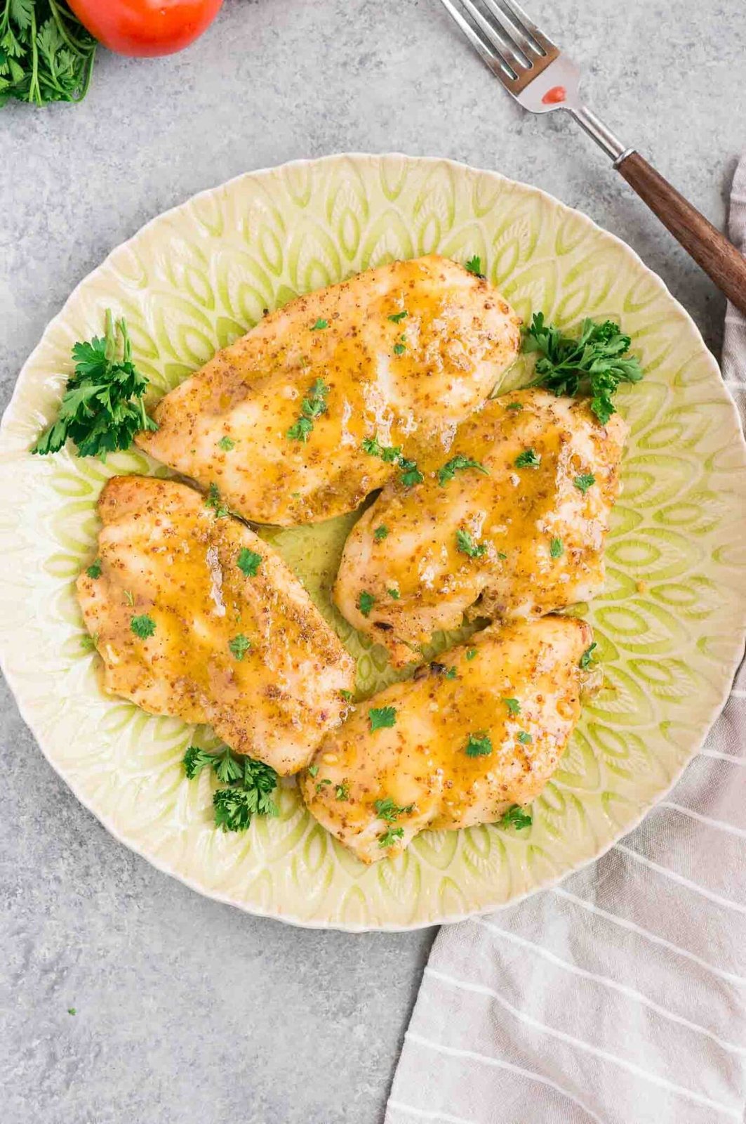 baked chicken in honey mustard sauce on a plate