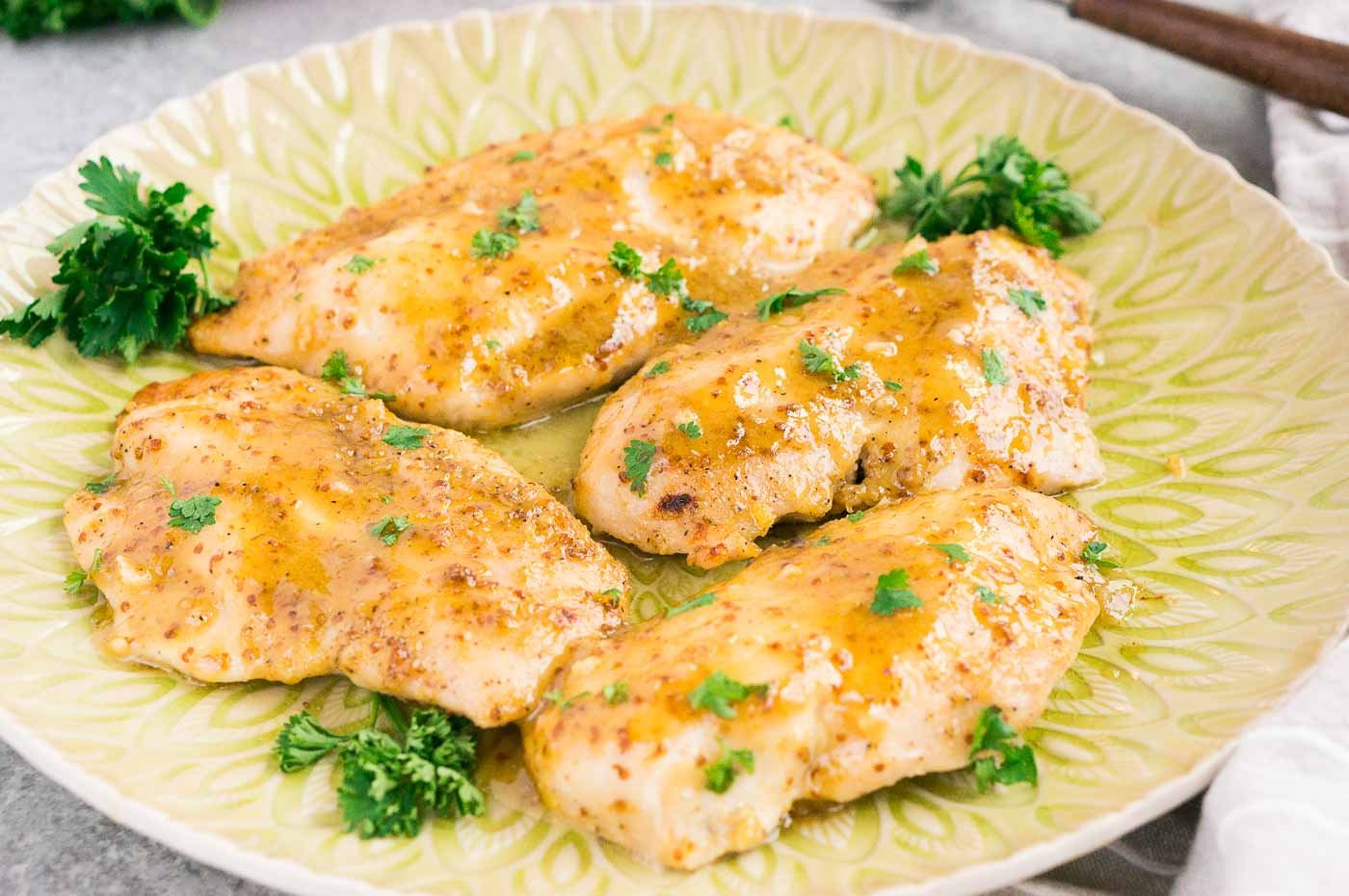 chicken in honey mustard sauce on a plate