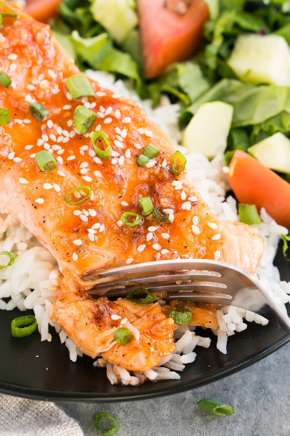 flaking salmon with a fork