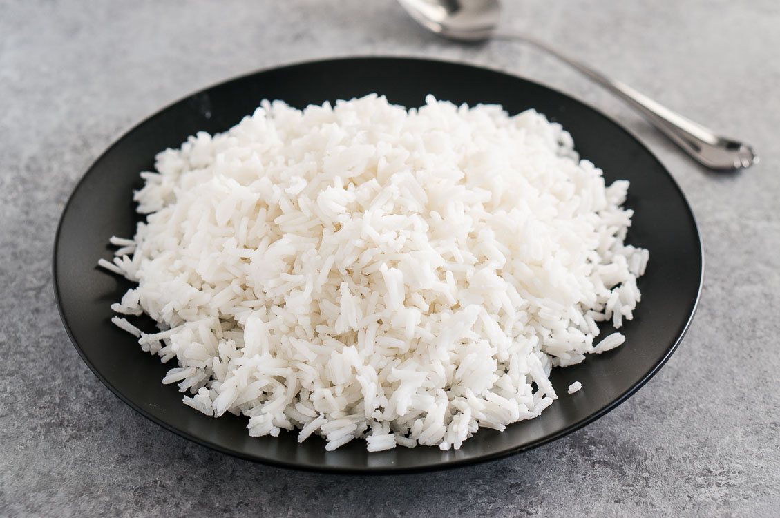 Fluffy rice on a black plate